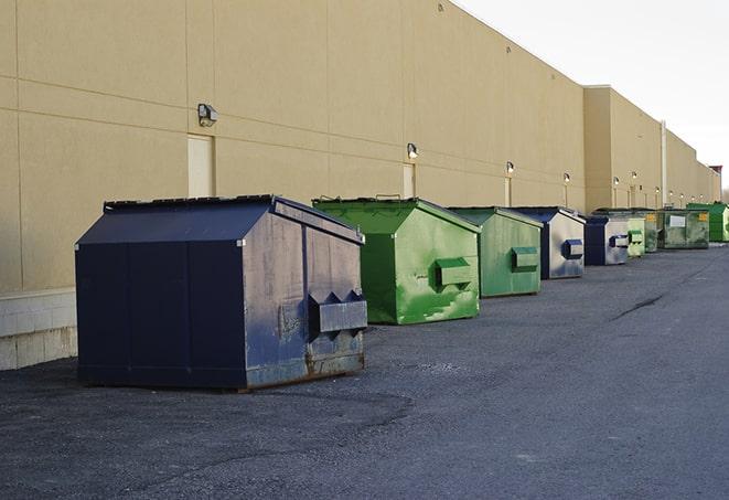 a pack of different construction bins lined up for service in Aransas Pass, TX